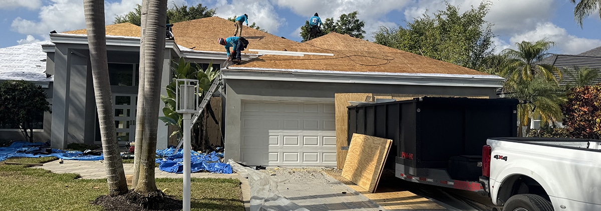 - Roof showing aging shingles and signs that a roof needs replacement
