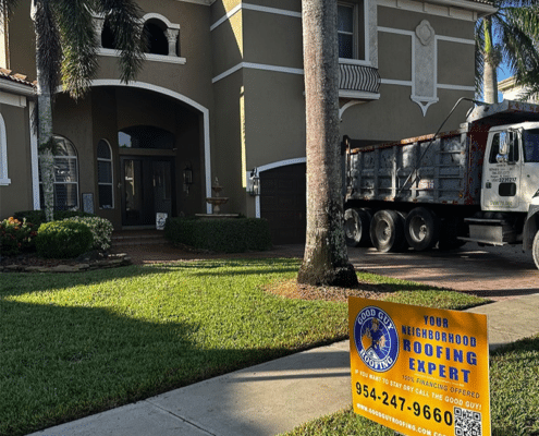 Professional repairing damaged asphalt shingle roof