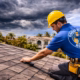 Roofer inspects shingles